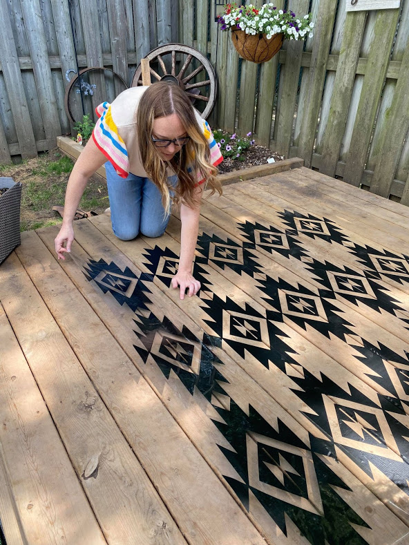 woman working with vinyl to create outdoor carpet